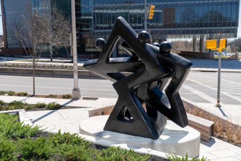 Back-view of Community of Stars sculpture outside of Coppin State University